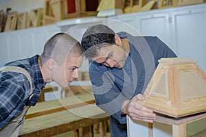 Cabinetmakers working in workshop