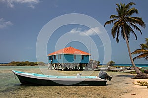 Cabins on stilts on the small island of Tobacco Caye, Belize