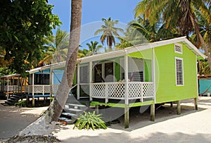 Cabins on stilts on the small island of Tobacco Caye, Belize