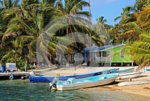 Cabins on stilts on the small island of Tobacco Caye, Belize photo