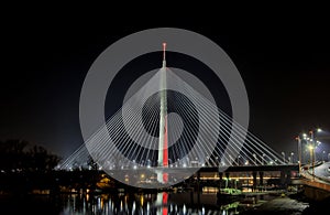 Cable bridge Belgrade at night with city lights