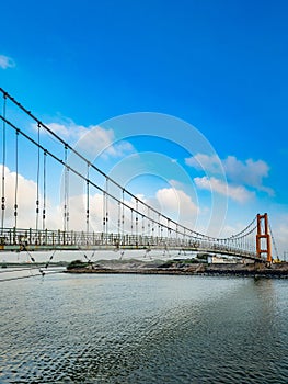 Cable bridge on Gomti river in Dwaraka, Gujarat, India.