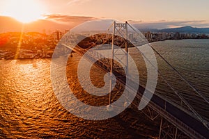 Cable bridge with sunset in Florianopolis, Brazil. Aerial view