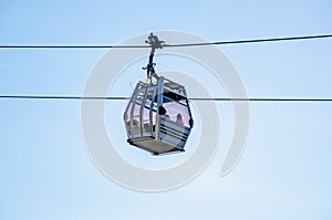 Cable car against the sky. ficicular cabins transport tourists to the mountains