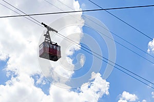 Cable car cabin on a sunny day against the blue sky