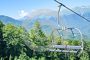 Cable car chair against picturesque mountain landscape