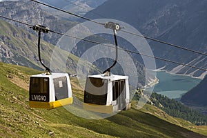 Cable car gondola in Alps mountains near Livigno lake Italy