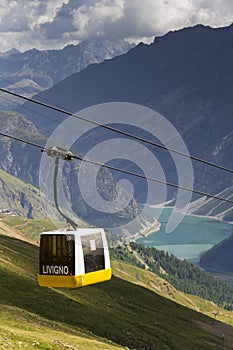 Cable car gondola in Alps mountains near Livigno lake Italy