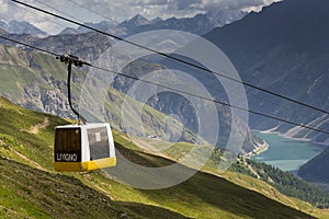 Cable car gondola in Alps mountains near Livigno lake Italy