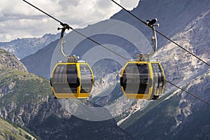 Cable car gondola in Alps mountains near Livigno lake Italy