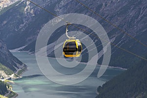 Cable car gondola in Alps mountains near Livigno lake Italy