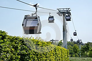 Cable Car in landscape park. Transport tourists uphill, cableway cabins. Ropeway, aerial lift.