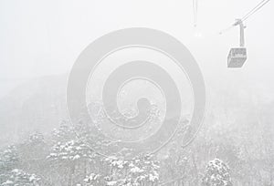 Cable car moving on sling in heavy snow falling weather in Hakodate, Hokkaido, Japan.