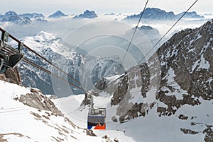 Cable car rope way mountain scenery, winter Italy Dolomites, Marmolada