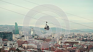 cable car rope way over Georgian capital Tbilisi, aerial of historical district