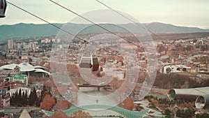 cable car rope way over Georgian capital Tbilisi, aerial of historical district