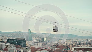 cable car rope way over Georgian capital Tbilisi, aerial of historical district