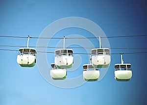 Six hanging cable car with blue sky