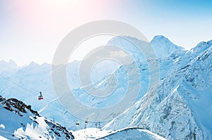 Cable car on the ski resort in the winter mountains.