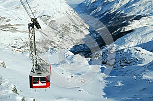 Cable car on snowy mountain