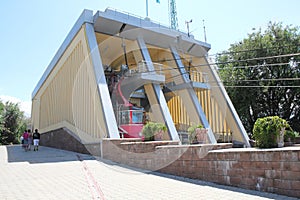 Cable car station with a trailer in the park on Mount Kok Tobe in Alma-Ata