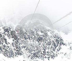 Cable car to Lomnicky stit peak, High Tatras region, Slovakia. Winter and cloud weather