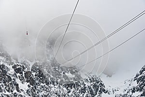 Cable car to Lomnicky stit peak, High Tatras region, Slovakia. Winter and cloud weather