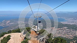 Cable car to Mount Babadag. Lifting car on a high mountain. View from the mountain to the Mediterranean Sea. Blue Lagoon in