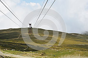 Cable car on top of the mountain above the clouds