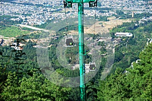 Cable cars carry people to the summit of Mount Cangshan