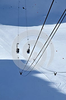 Cable cars passing over a glacier