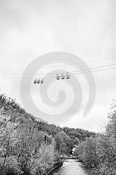 Cable cars passing over the River Derwent