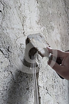 cable cementing in the wall with cement mortar