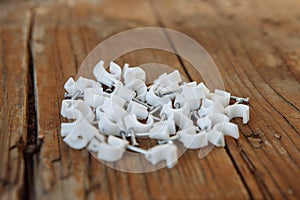 Cable clip round white with a nail on background