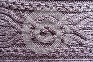 Cable knitting technique on puce knitwork