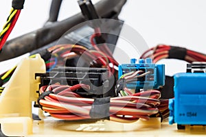 A cable of matted wires of different colors with connectors in the electrical wiring of the car. Internet line in the work of the