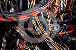 A cable of matted wires of different colors with connectors in the electrical wiring of the car. Internet line in the work of the
