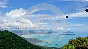 Cable park in the green mountains of a tropical island. High altitude cable car with breathtaking landscape view.