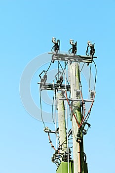 Cable power lines hanging from a solitary pole