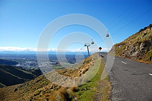 Cable railway over road turns right town view