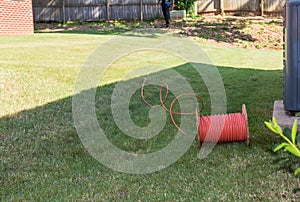 Cable Repair Man Running Coaxial Cable to Residence photo