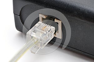 Cable with Rj 11 plug for a telephone line on a white background