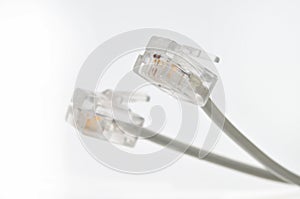 Cable with Rj 11 plug for a telephone line on a white background