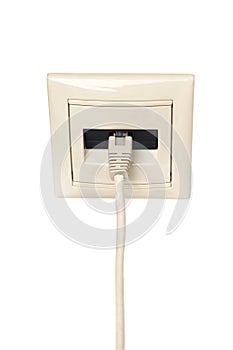 Cable with RJ-45 connector is connected to a wall outlet.