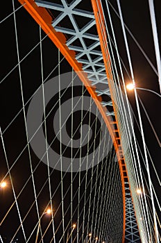 Cable-stayed through arch bridge (Bugrinsky Bridge) over river Ob at night, in Novosibirsk, Siberia, Russia