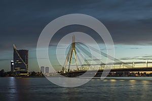 Cable stayed bridge across Daugava river at night in Riga, Latvia.