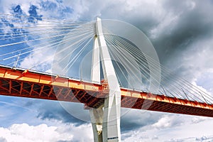 Cable-stayed bridge against a dark sky, close-up