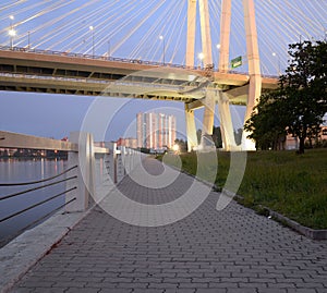 Cable stayed bridge and embankment of Neva river.