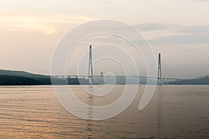 Cable-stayed bridge `Russky Bridge` to island Russkiy on the sunset. Vladivostok, Primorsky Krai, Russia