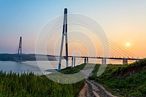 Cable-stayed bridge `Russky Bridge` to island Russkiy on the sunset. Vladivostok, Primorsky Krai, Russia